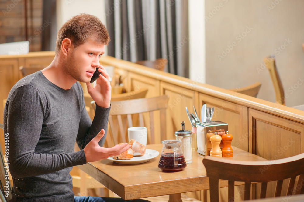 Handsome young man in cafe Handsome young man in cafe
