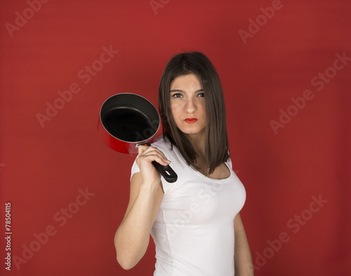 young girl with red pan