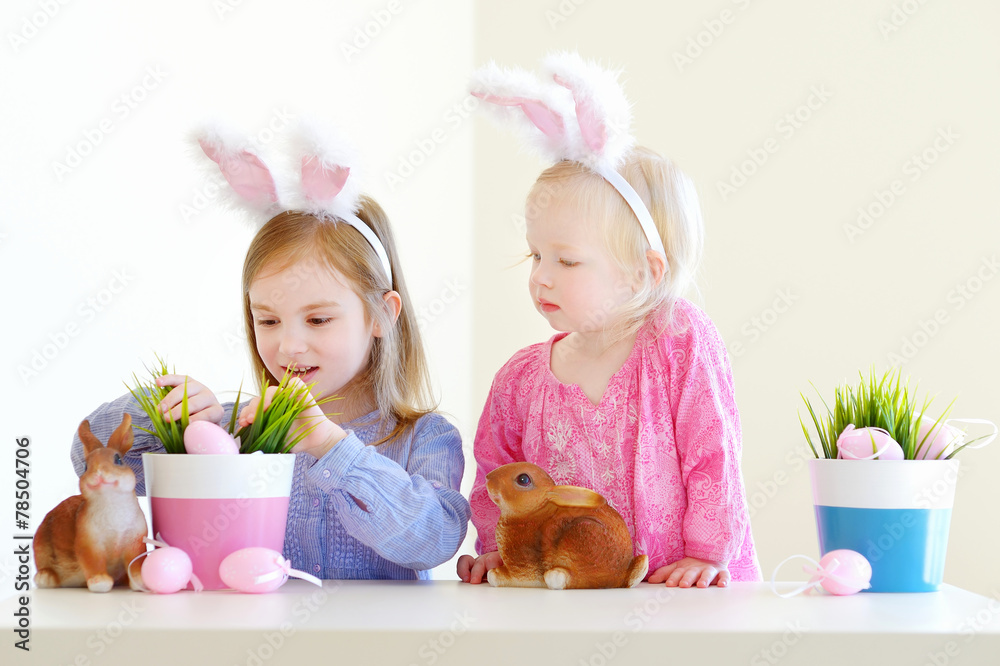 Two sisters wearing bunny ears on Easter Two sisters wearing bunny ears on Easter