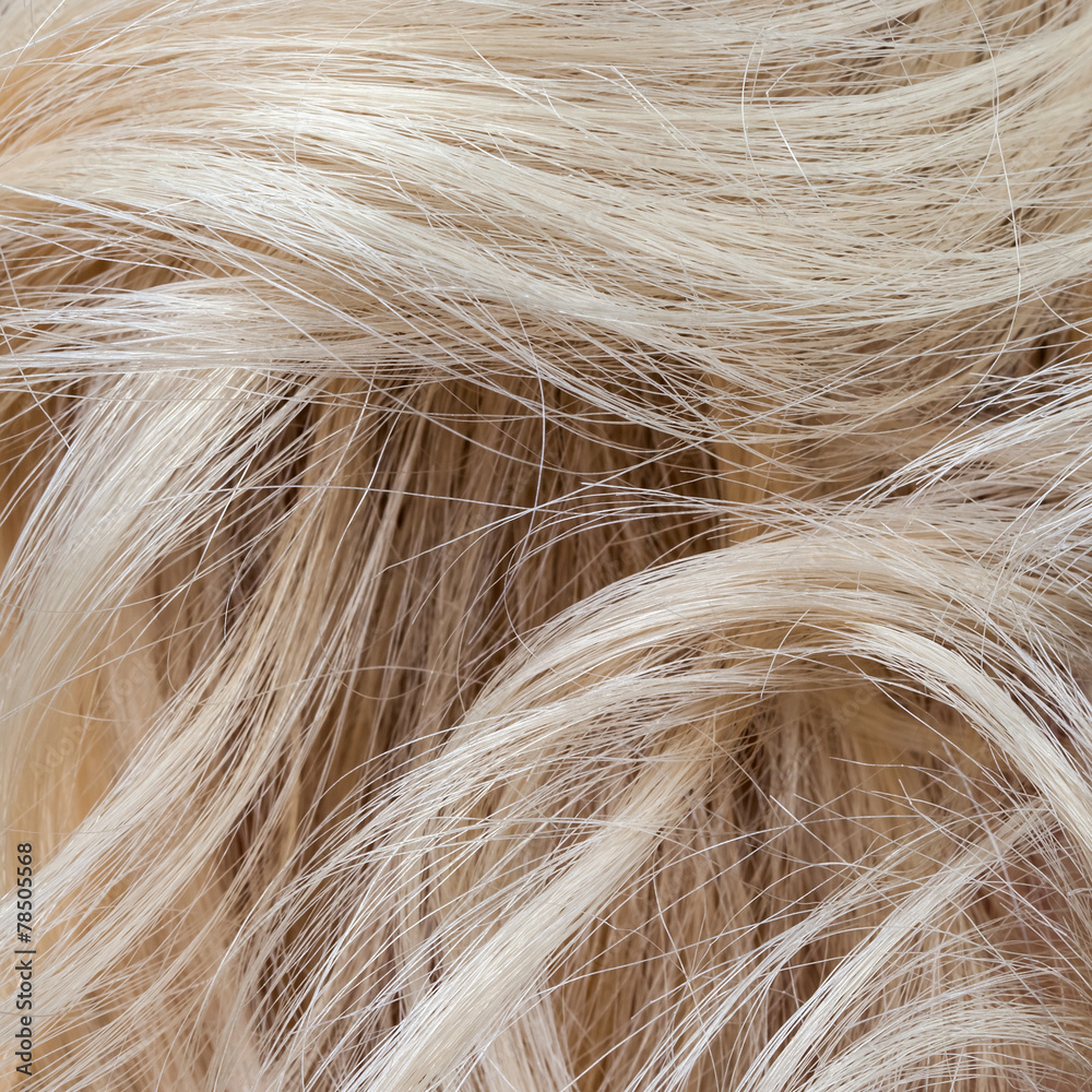 Fototapeta premium Wavy blonde woman hair background and texture