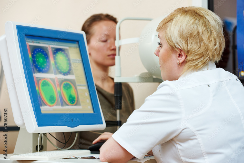 Ophthalmologist or optometrist optician at work Ophthalmologist or optometrist optician at work