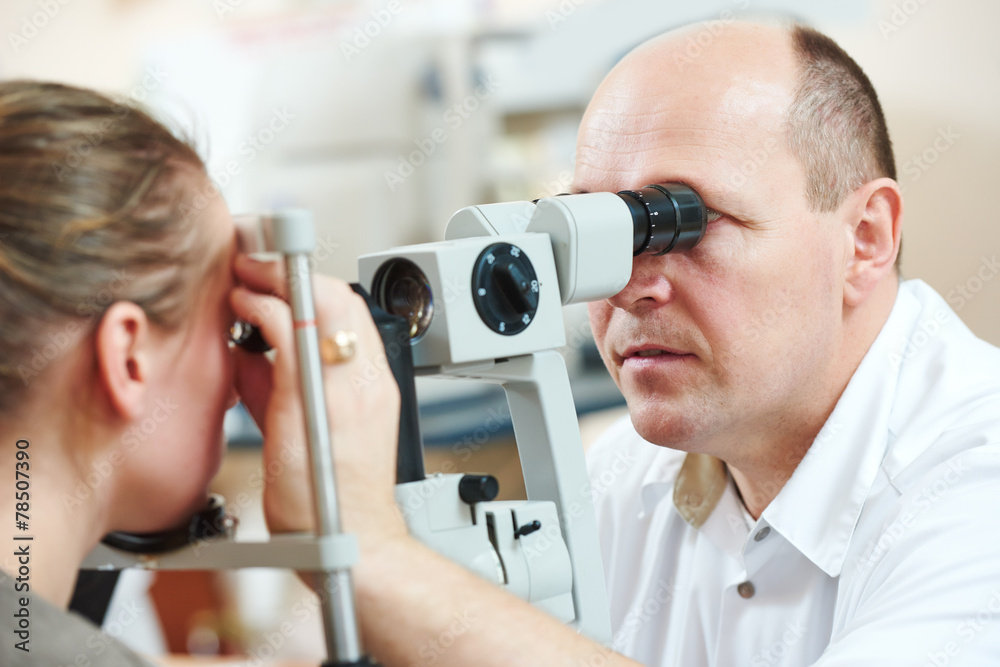 Fototapeta premium Ophthalmologist or optometrist optician at work