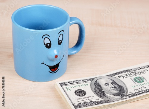 Cup and dollar. The cup is looking for dollars