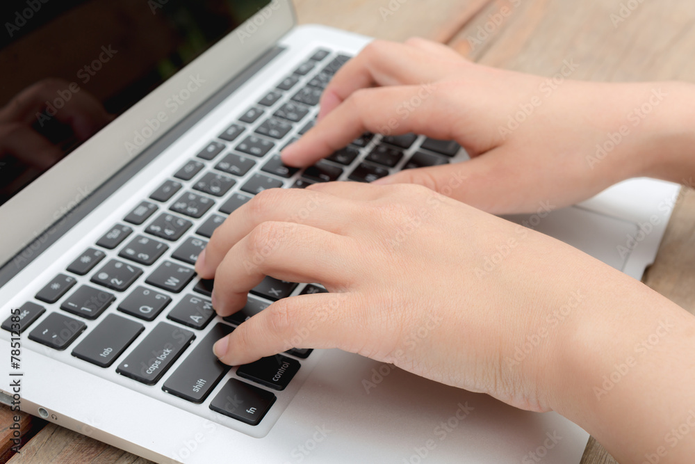 Closeup of business woman hand typing on laptop keyboard Closeup of business woman hand typing on laptop keyboard
