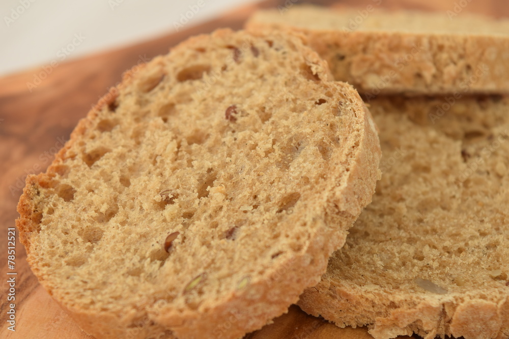 A slice of bread on a chopping board. A slice of bread on a chopping board.