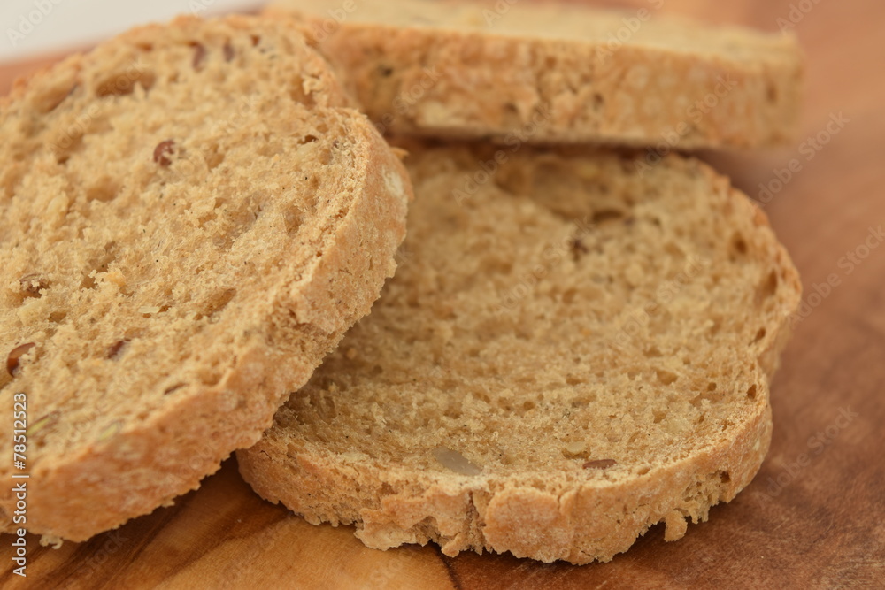 A slice of bread on a chopping board.