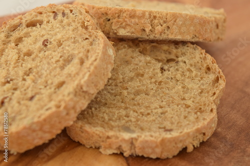 A slice of bread on a chopping board.