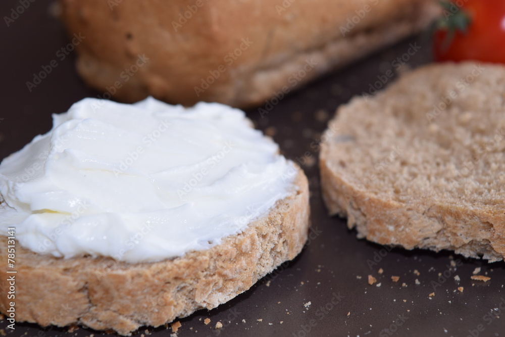 Slice of bread with cream cheese. Slice of bread with cream cheese.