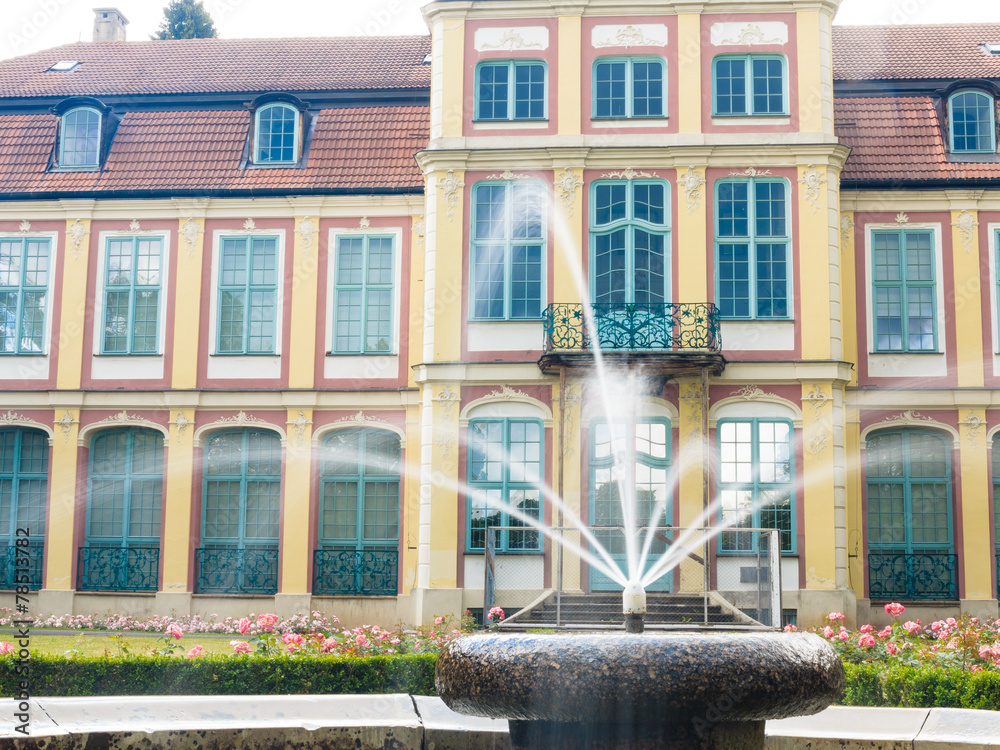 abbots palace in gdansk oliva park. building with fountain