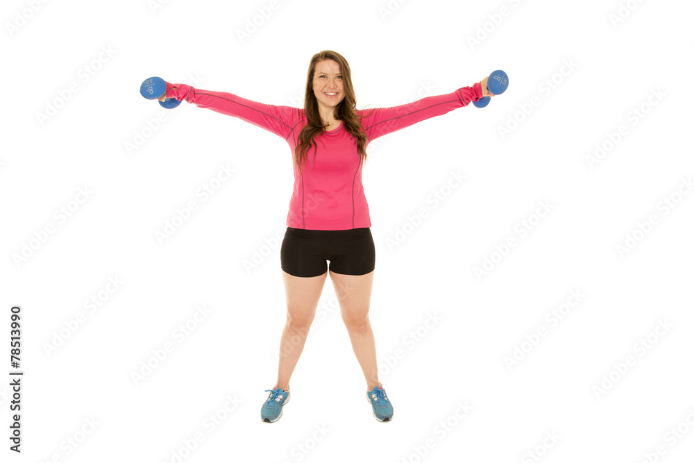 Young brunette woman lifting barbells arms extended Young brunette woman lifting barbells arms extended