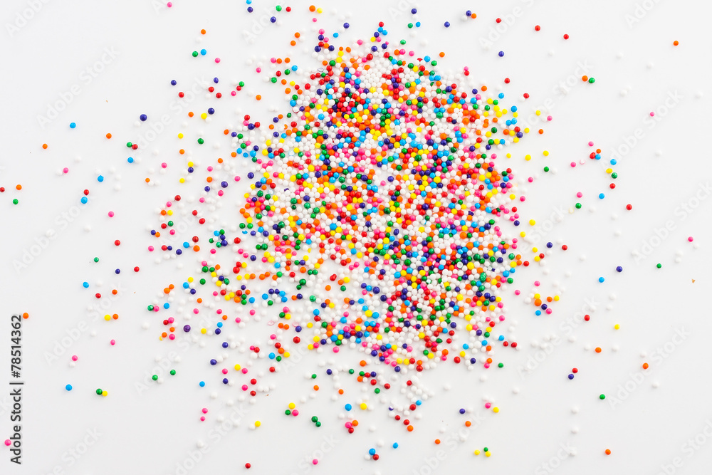 Colorful round sprinkles spilled on white background, isolated - obrazy, fototapety, plakaty 