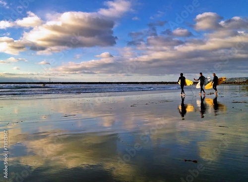 Canvas Print Three Surfers at Dog Beach, Ocean Beach, San Diego, CA, USA