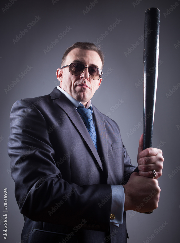 male gangster with glasses and a baseball bat Stock Photo | Adobe Stock