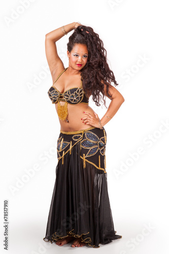 Young belly dancer in black costume