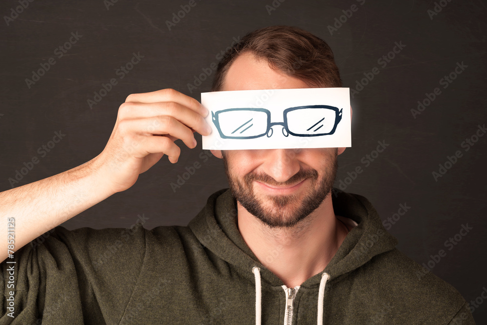 Happy guy looking with paper hand drawn eye glasses Happy guy looking with paper hand drawn eye glasses