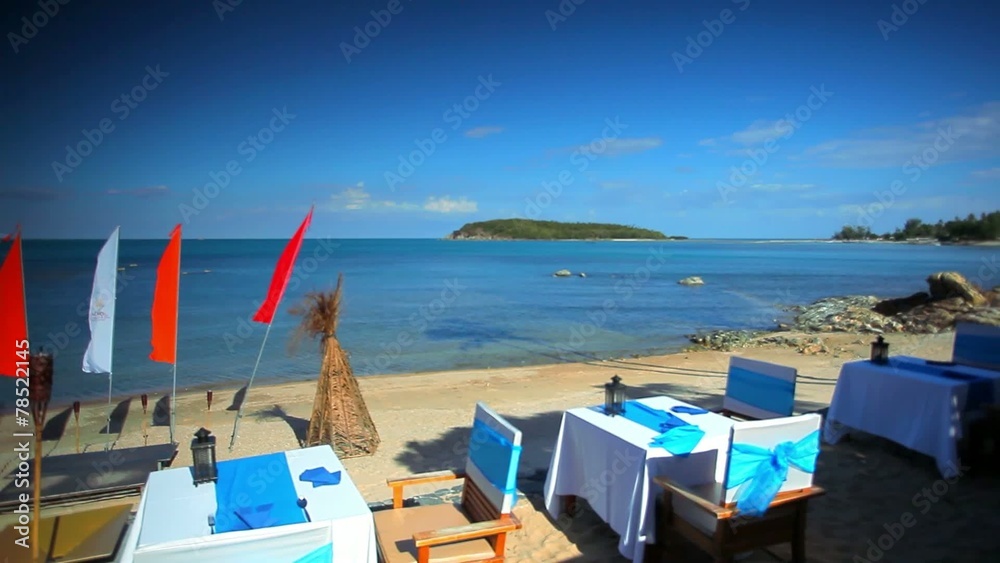 Beach restaurant with a beautiful sea view and waving flags Beach restaurant with a beautiful sea view and waving flags