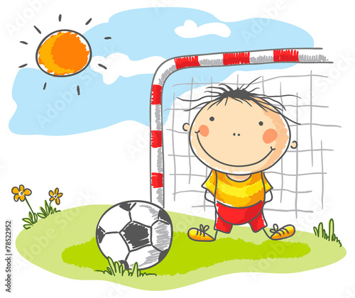 Boy playing football as a goalkeeper