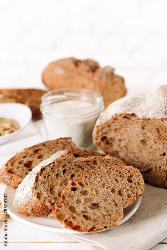 Naklejka premium Tasty bread on table on light background