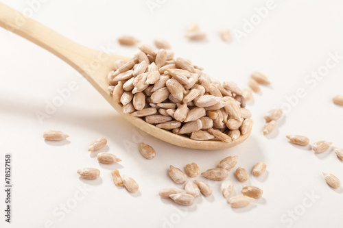 Sunflower seeds in a wooden spoon