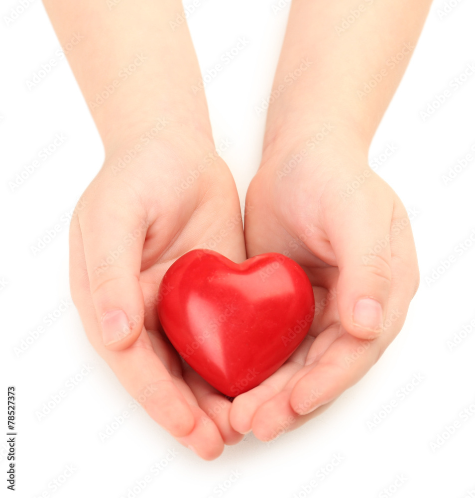 Heart in child hands isolated on white Heart in child hands isolated on white