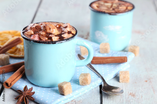 Mugs of hot coffee with marshmallow