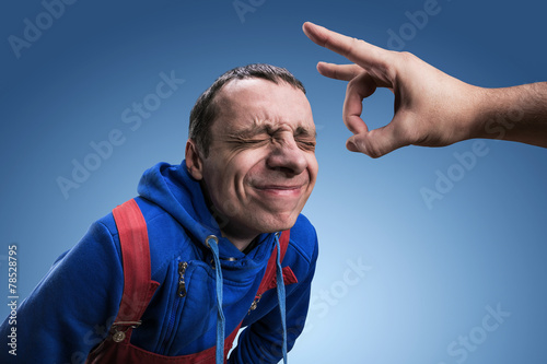 Fillip on forehead photo