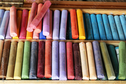 Colorful chalk pastels in box close up