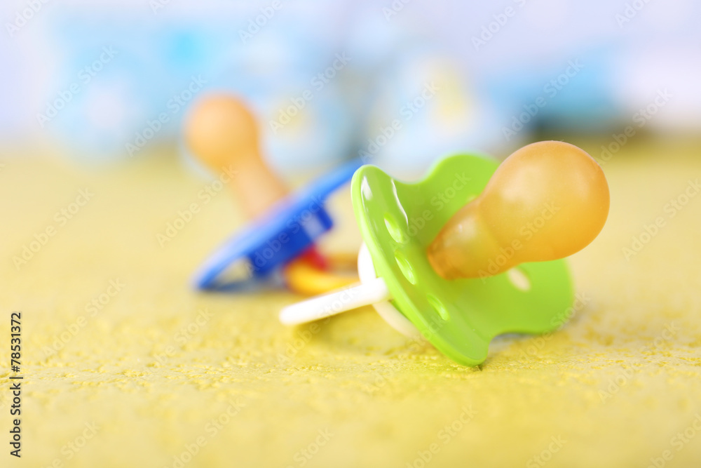 Dummy for baby, close-up, on bright background Dummy for baby, close-up, on bright background