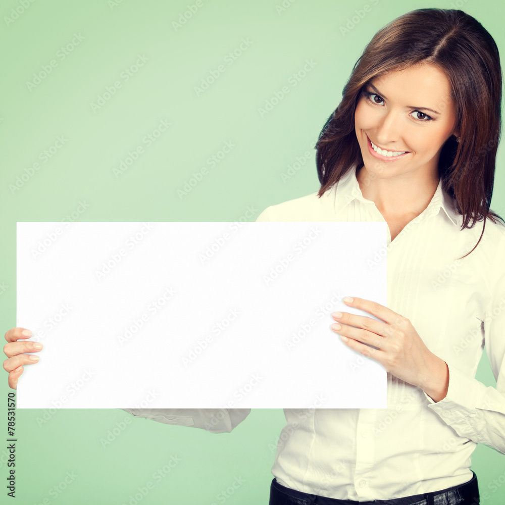 Businesswoman showing signboard, over green Businesswoman showing signboard, over green