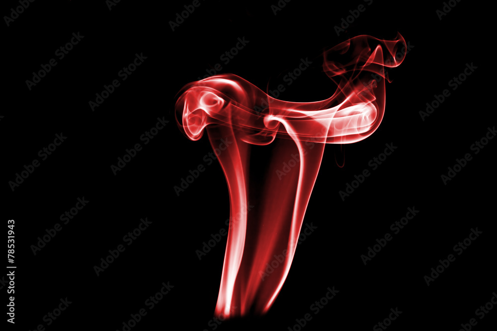red colored smoke on a black background. red colored smoke on a black background.