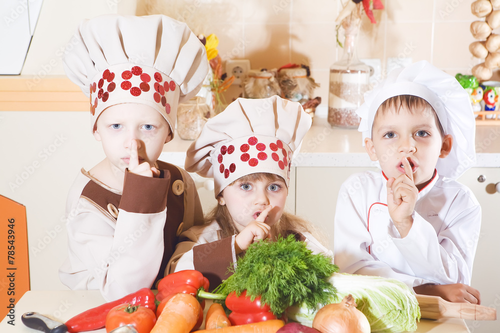 the children boy and girl prepare food in the kitchen the children boy and girl prepare food in the kitchen