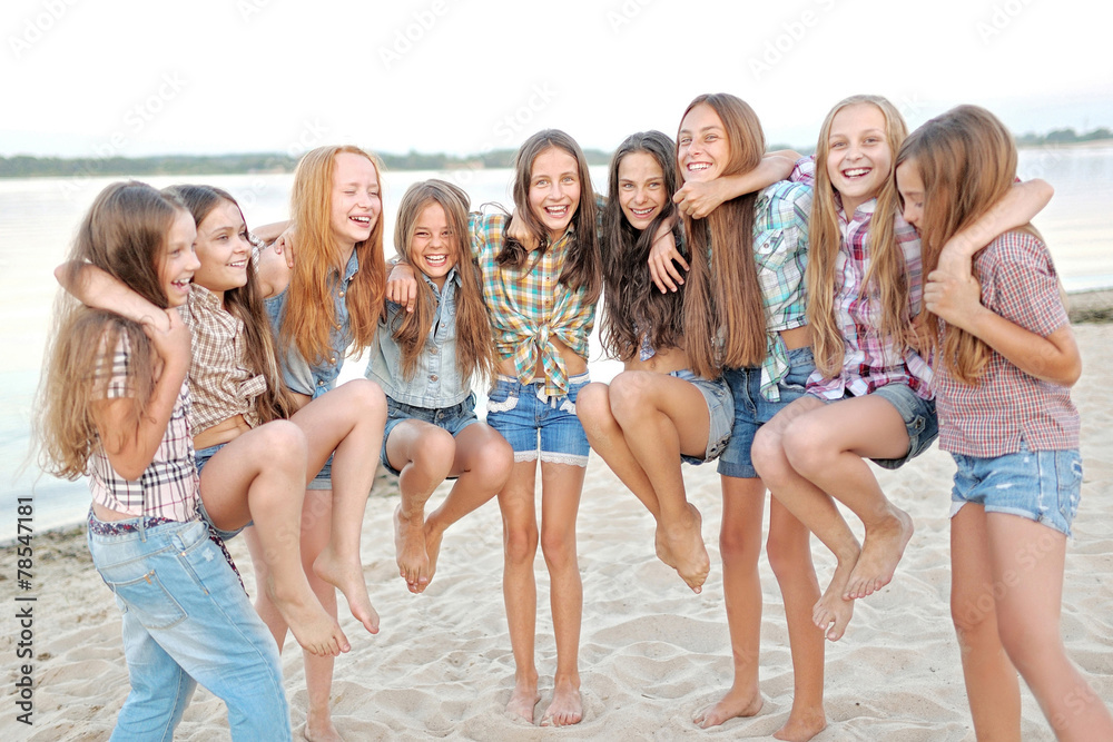 Portrait of joyful beautiful girlfriends on the nature Portrait of joyful beautiful girlfriends on the nature