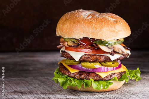 Double patty hamburger with a variety of ingredients