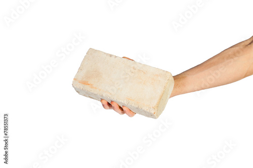 Female hand picking up white brick over white background