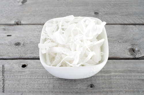 Photography Mut Dua, Vietnamese dried and sweetened coconut slices against w