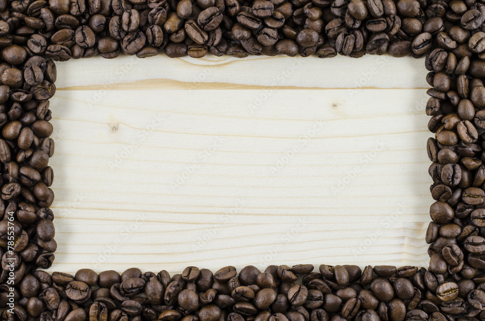 Frame of coffee beans on wooden table. Background Frame of coffee beans on wooden table. Background