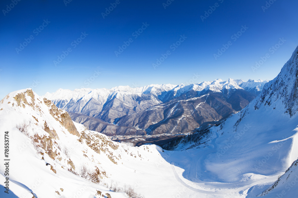 Panorama of snowy mountains from the peak in Sochi