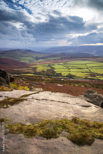 Beautiful late evening Autumn light over Stanage Edge Peak Distr photo