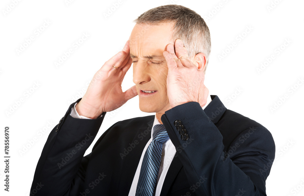 Businessman suffering from headache Businessman suffering from headache
