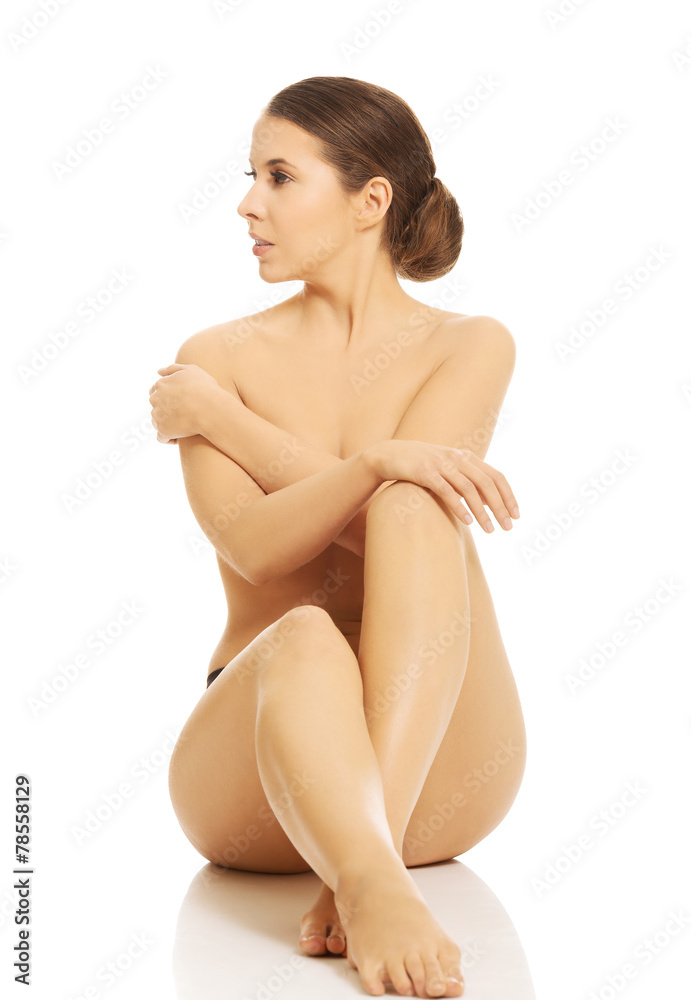 Fototapeta premium Nude woman sitting on the floor