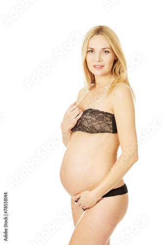 Smiling pregnant woman in lingerie © Piotr Marcinski