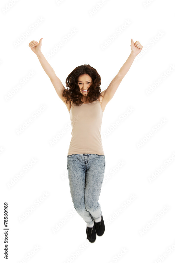 Young casual woman jumping.
