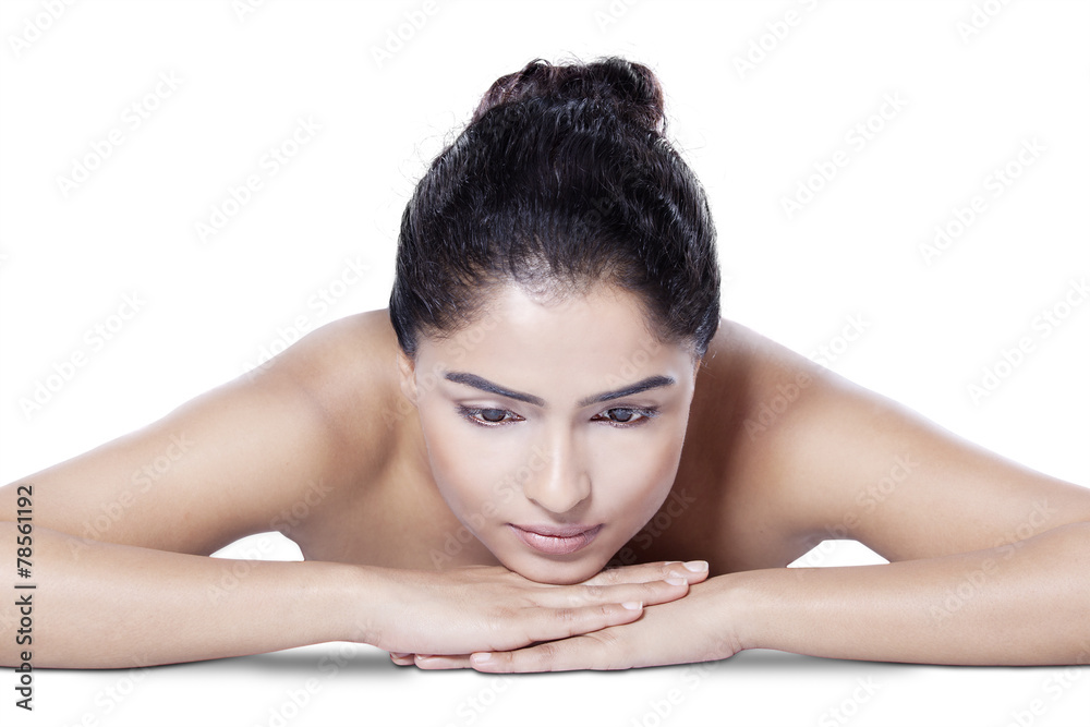 Pretty woman lying down on her hands Pretty woman lying down on her hands