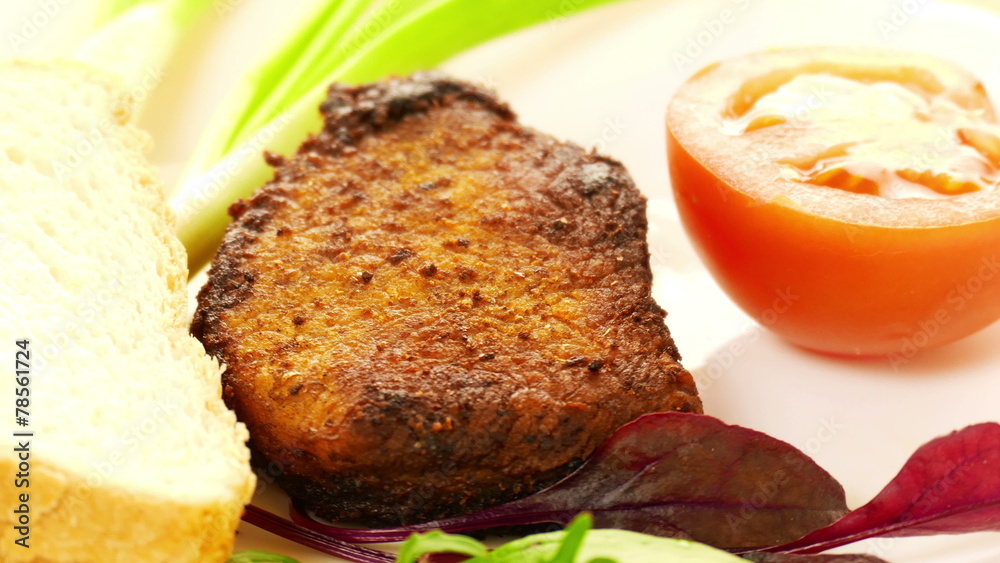 Grilled meat on a white plate Grilled meat on a white plate
