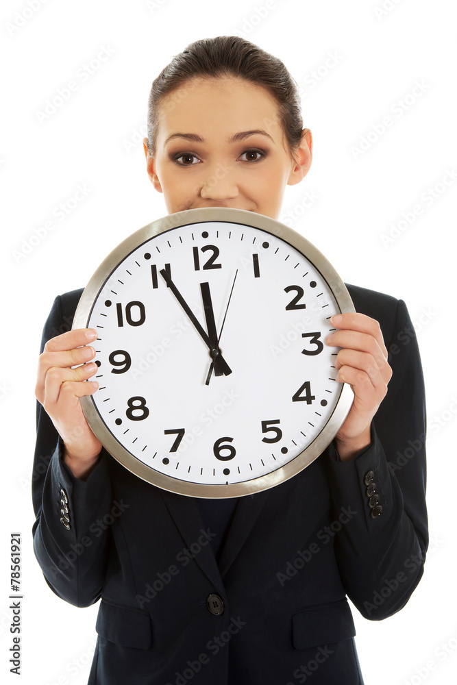 Businesswoman holding a big clock. Businesswoman holding a big clock.