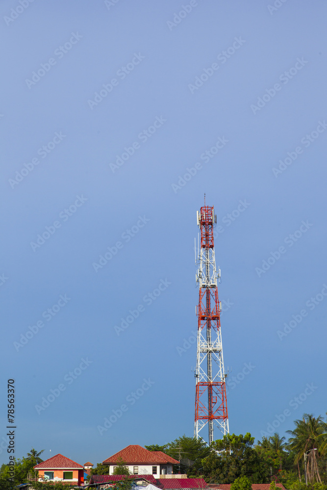 Telephone pole on blue sky background.