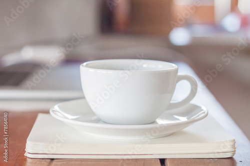 White coffee cup on work station