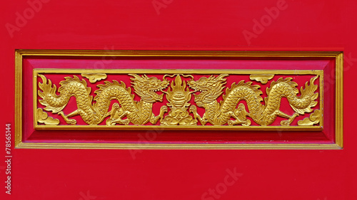 Wood carved golden dragon.