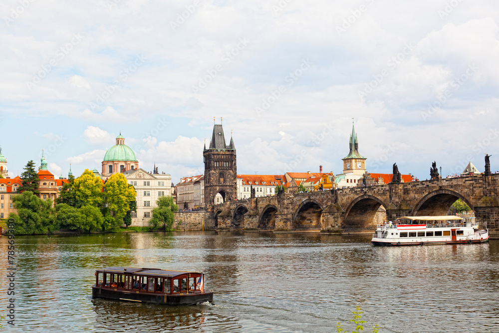 Tourist  ship floats under Charles bridge, Prague