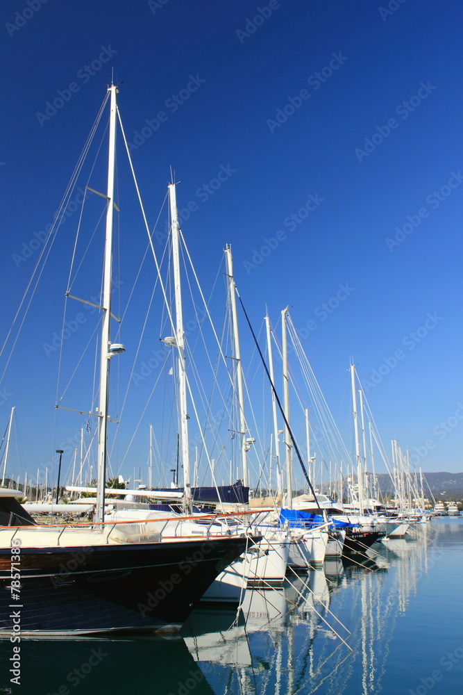 reflections of boats and yachts in harbour